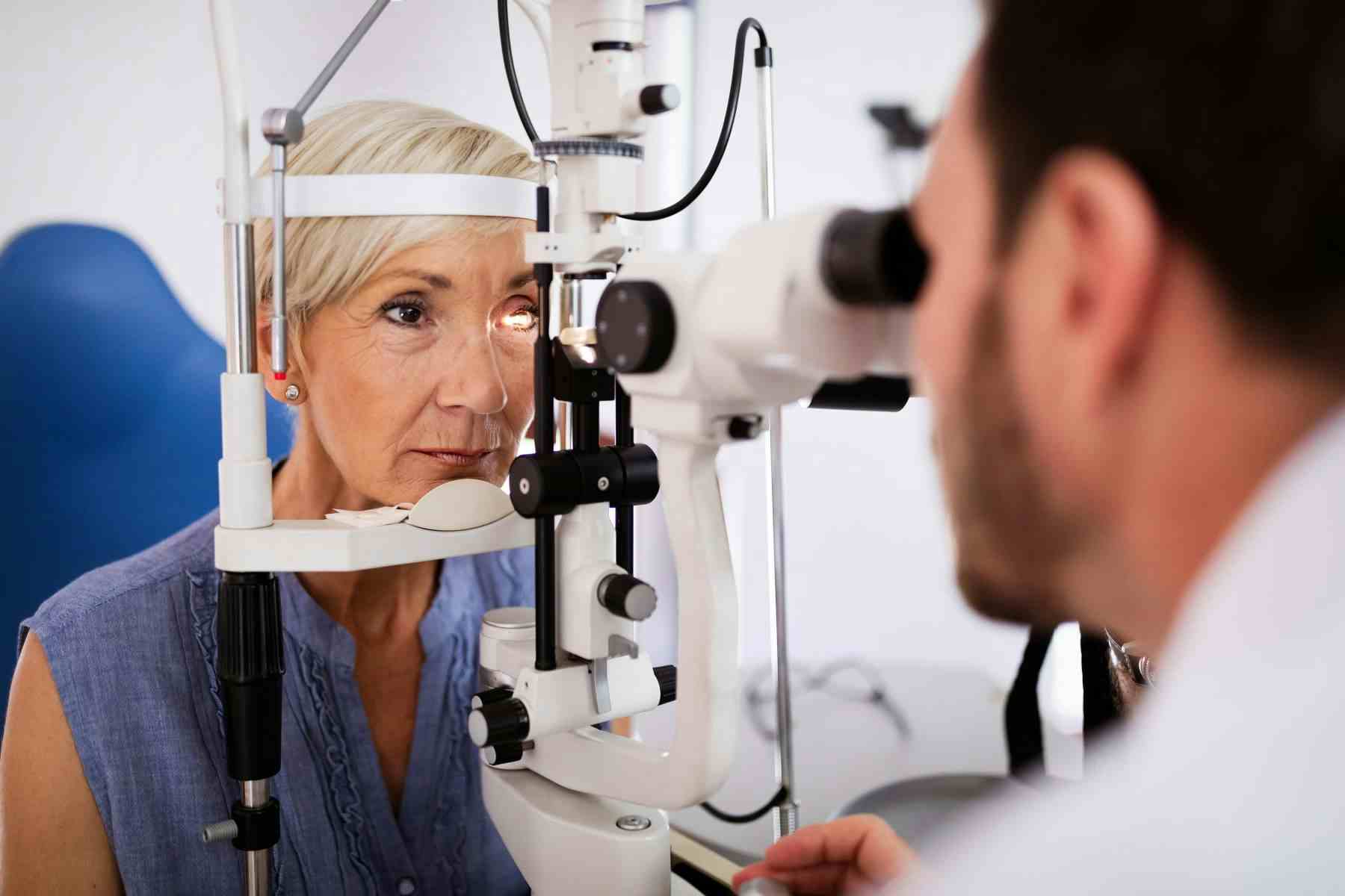 Ophthalmologist giving eye exam